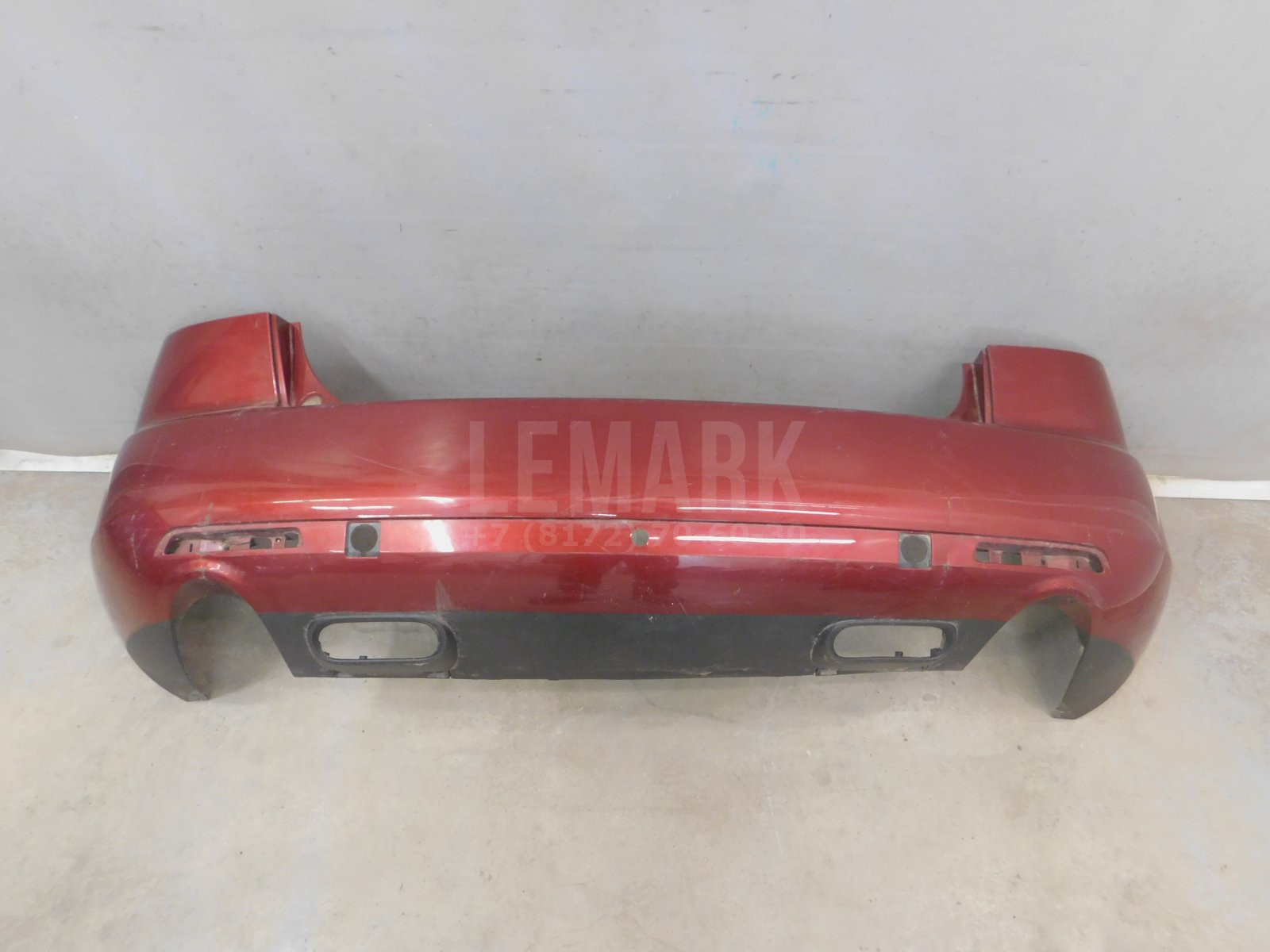 Бампер задний Mazda CX7 2007> EG2150221
