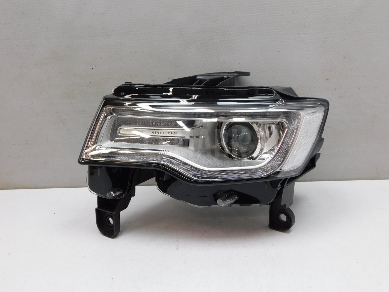 Фара левая Jeep Grand Cherokee (WK2) 2010> 68144709AC